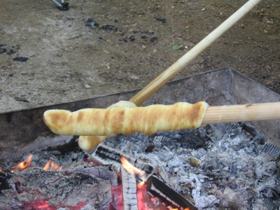 Photo of woof 'ems cooking on a stick